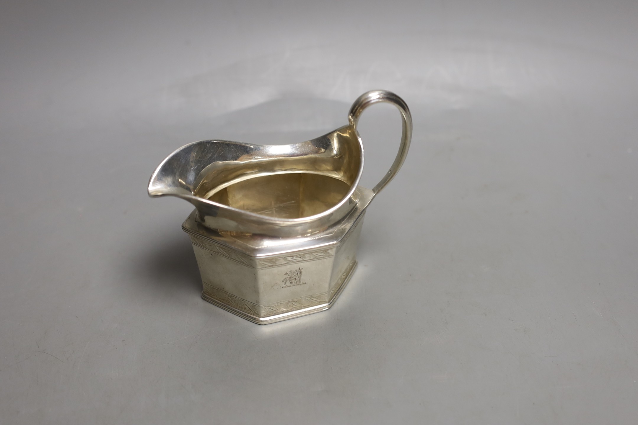 A George V silver hexagonal cream jug, London, 1930, 7oz.